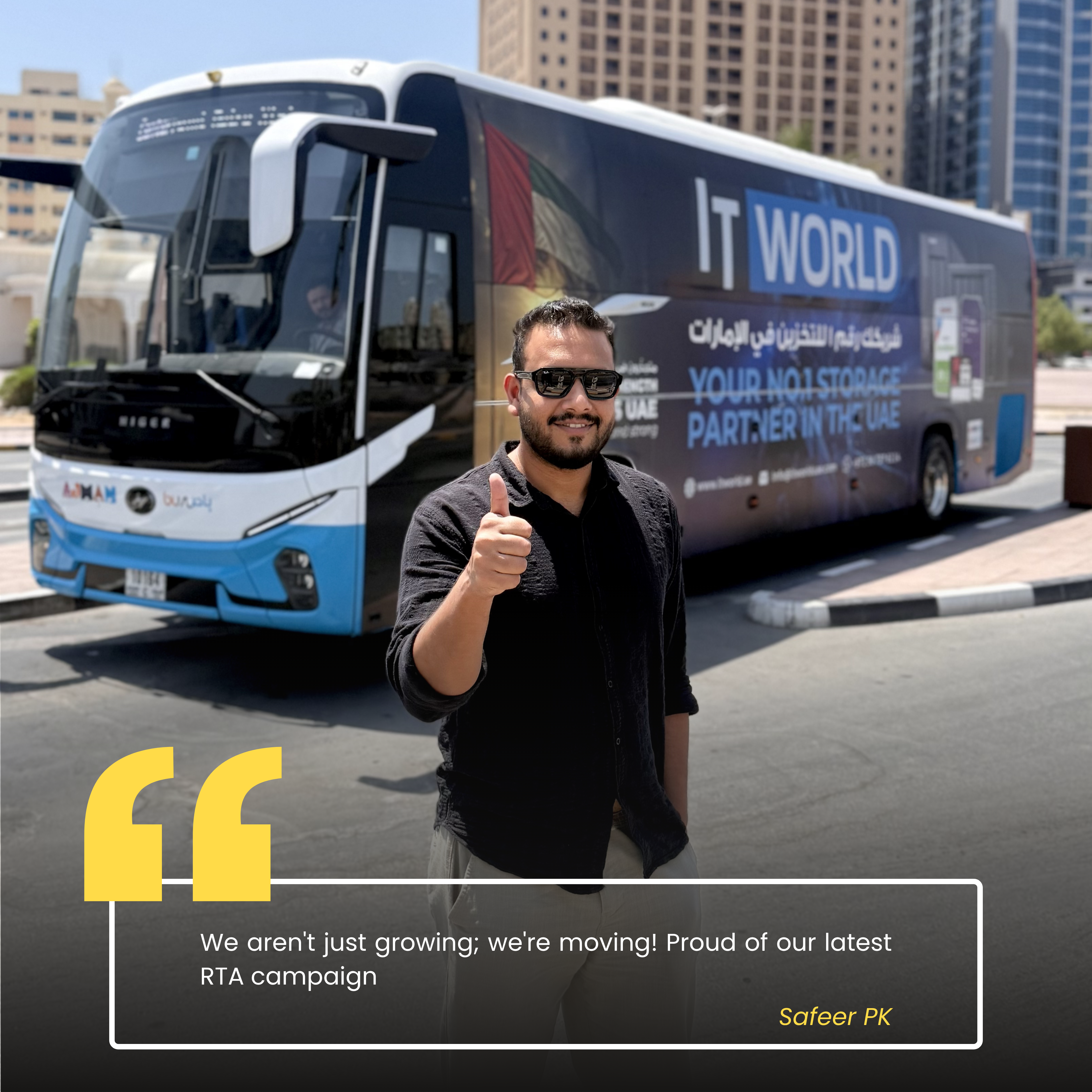 Safeer — IT World Trading team member, photographed beside the RTA campaign bus